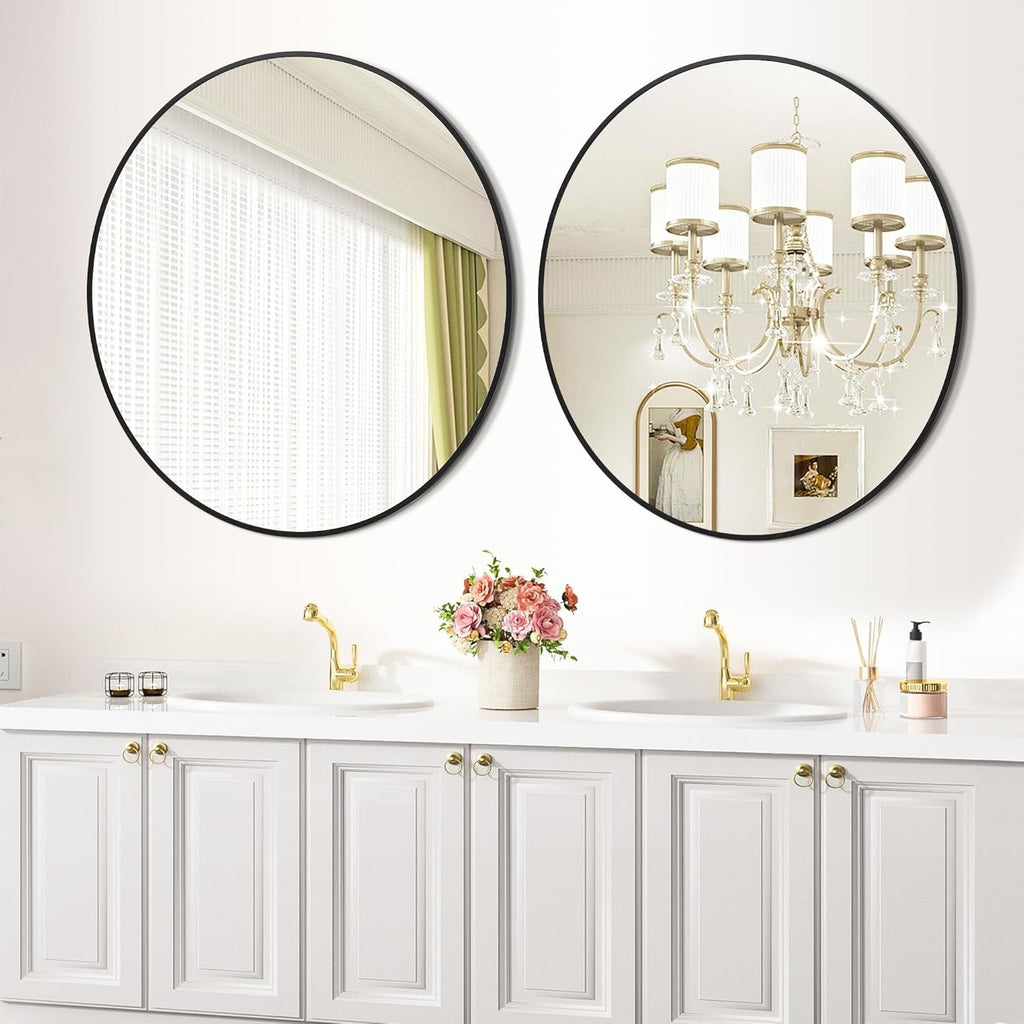 Bathroom with round mirrors on the wall, white cabinets, and decorative elements.