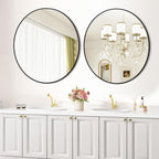Bathroom with round mirrors on the wall, white cabinets, and decorative elements.