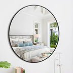 Round wall mirror in a bedroom setting with features highlighted.