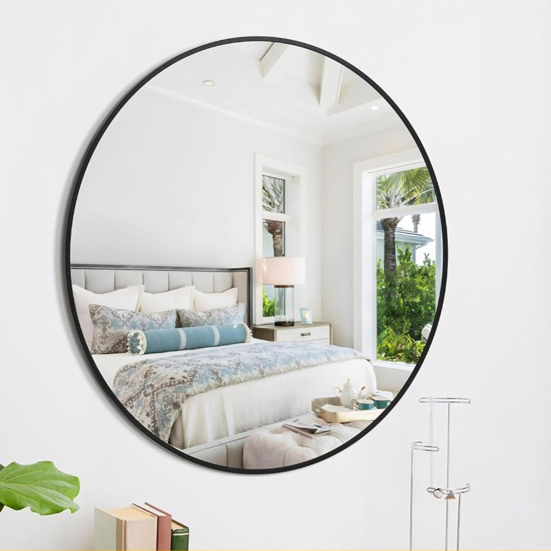 Round wall mirror in a bedroom setting with features highlighted.