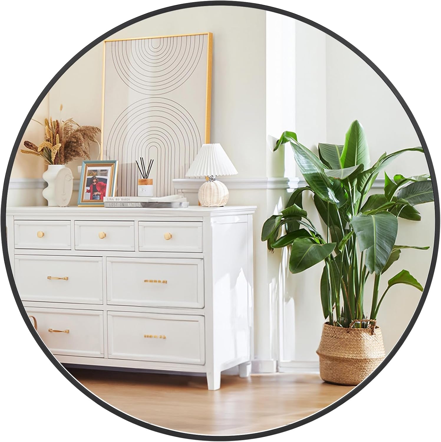 White dresser with decorative items and a potted plant in a room.