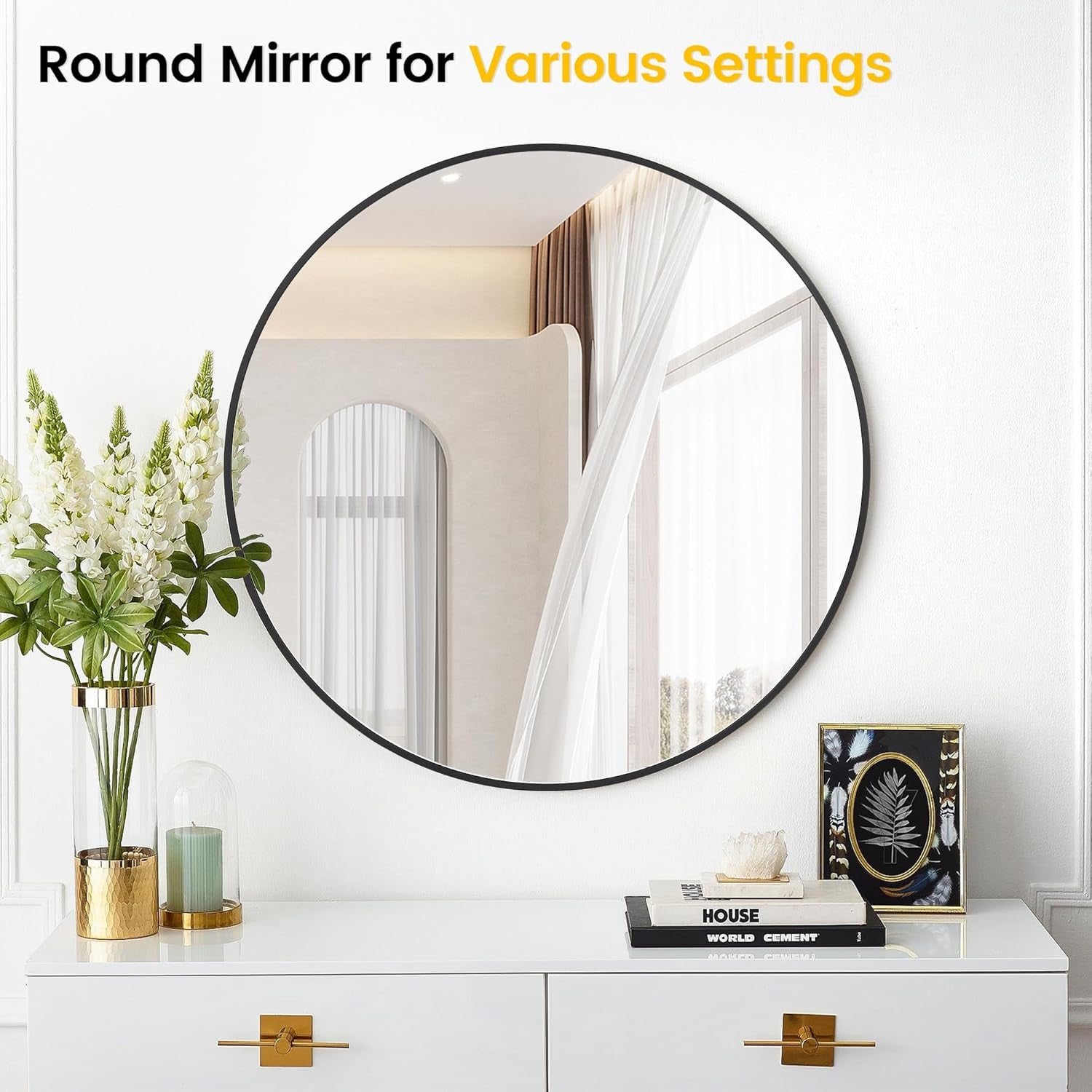 Round mirror on a wall with decor items below