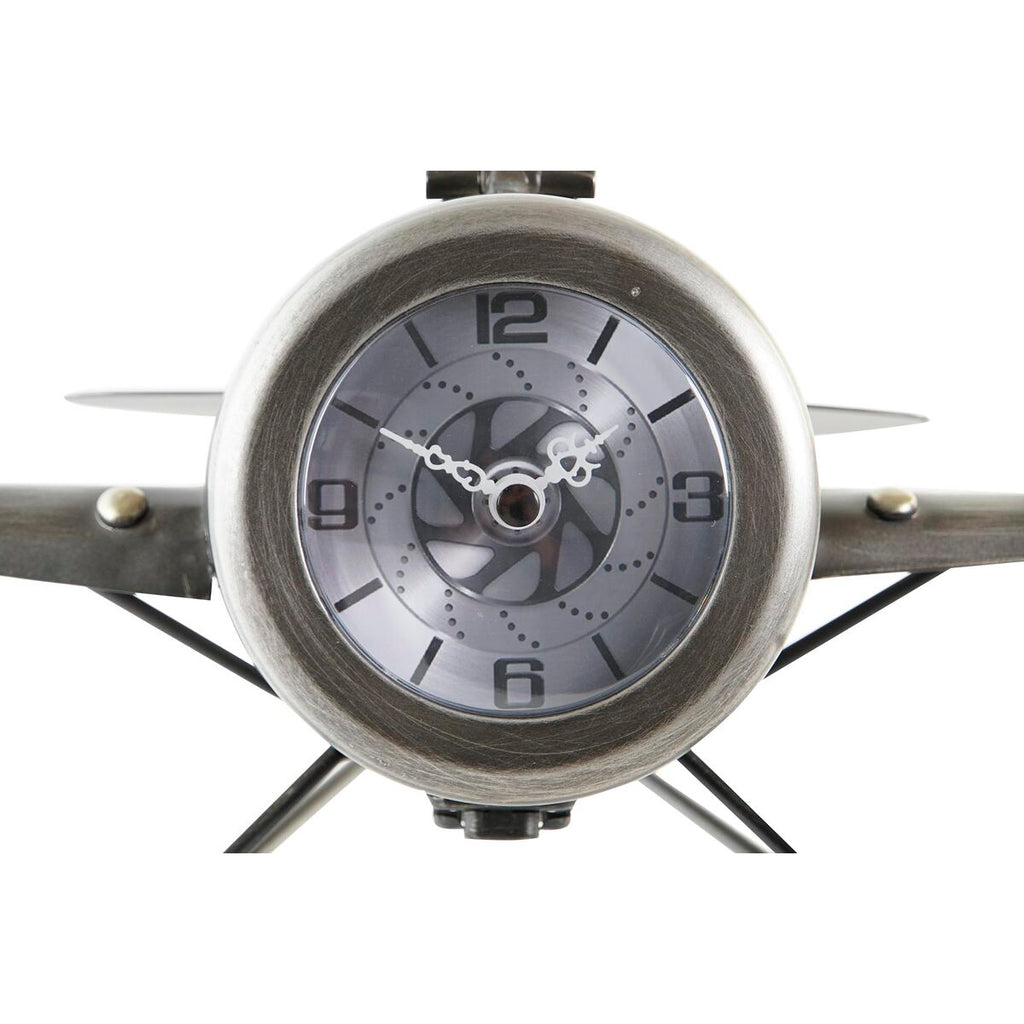 Metallic clock with star-shaped design on a white background