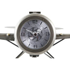 Metallic clock with star-shaped design on a white background