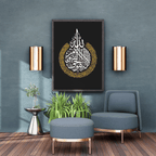 Modern living room with a gray armchair, ottoman, and decorative wall art.