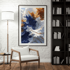 Framed abstract art piece in a living room setting with a chair and bookshelf.