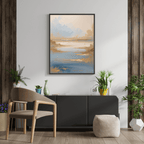 Modern interior with a painting of a sunset over water, a chair, and decorative plants.