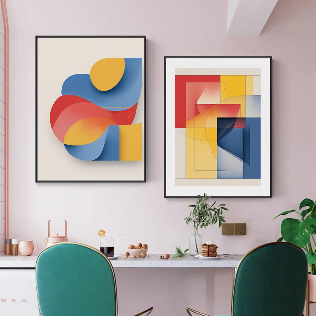 Two abstract art pieces on a wall with a table and chairs below.