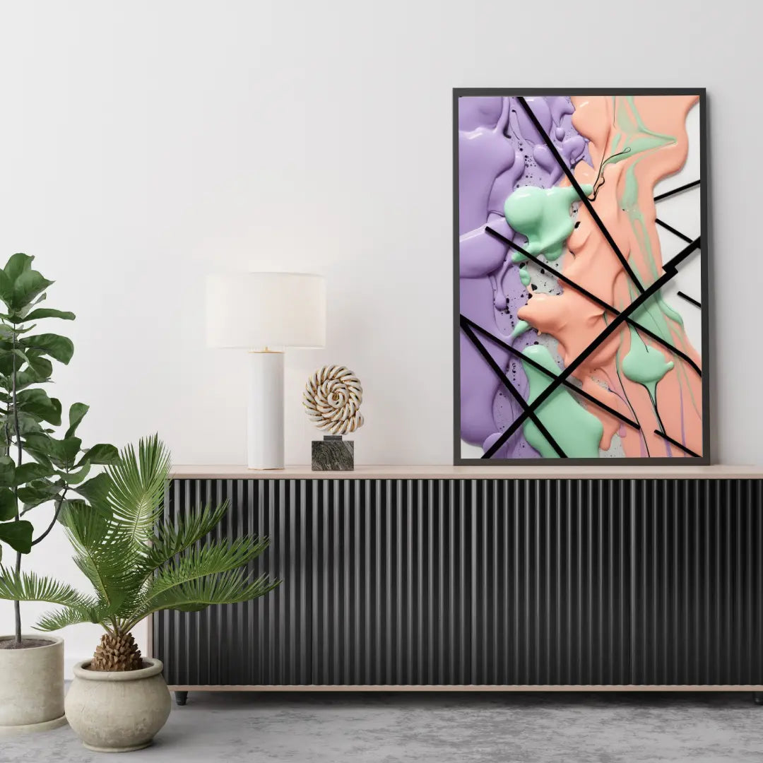 Abstract art piece on a wall above a console table with plants and decor.