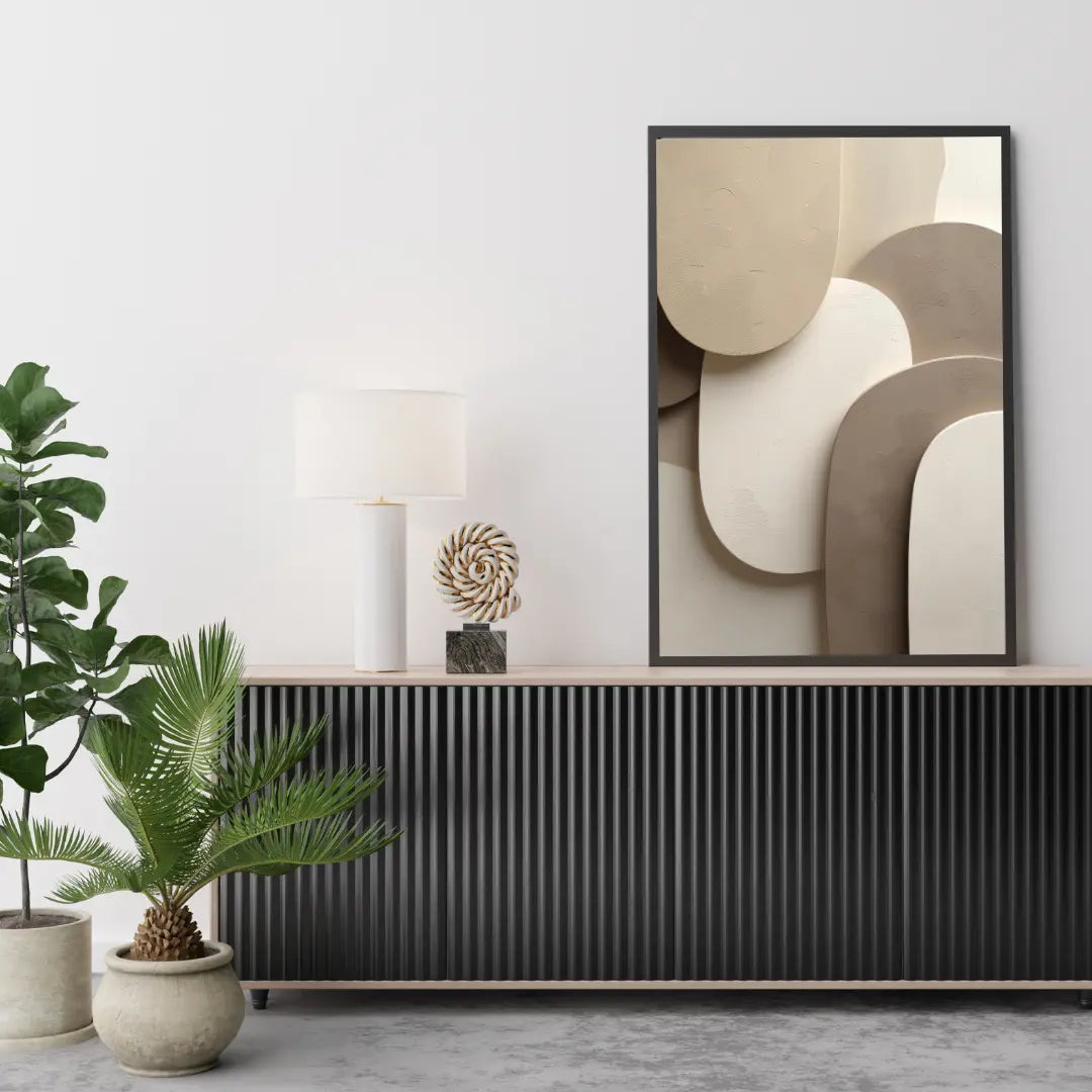 Modern interior design with abstract art, plants, and decorative items on a console table.