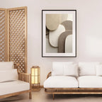 Modern living room with white sofa, wooden armchair, and abstract art on the wall.