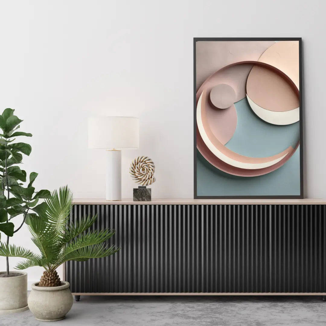 Abstract art piece on a wall above a console table with decorative items and plants.