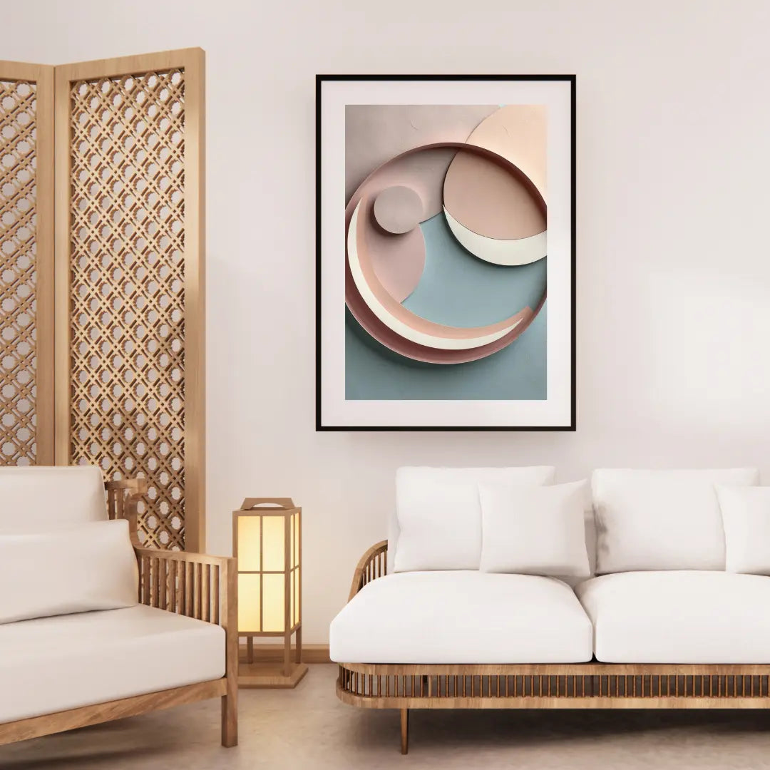 Modern living room with a framed abstract art piece on the wall, white sofa, and wooden armchair.