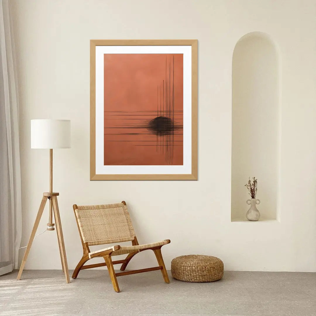 Modern interior with a framed abstract art piece, wicker chair, and floor lamp.