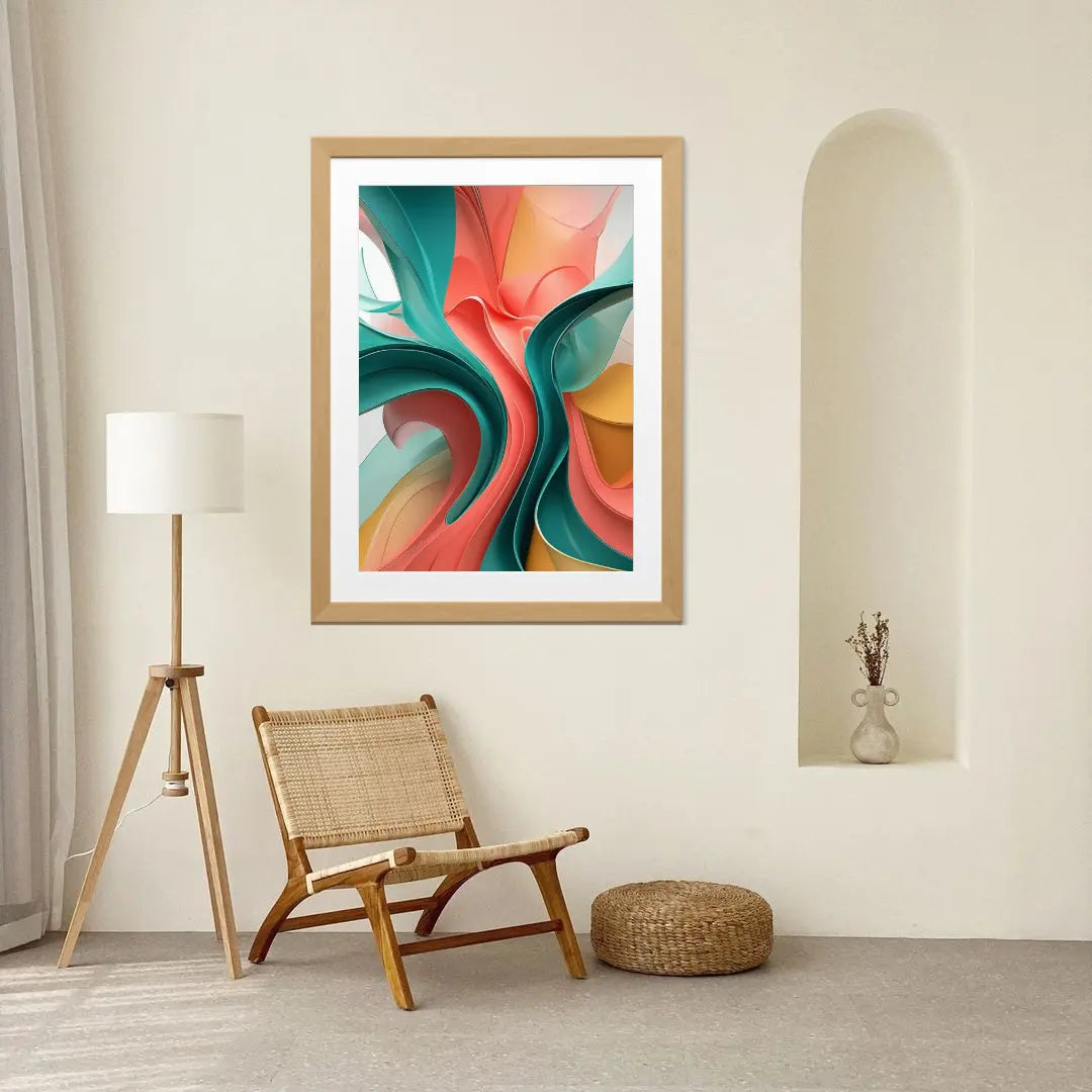 Colorful abstract art in a wooden frame on a wall above a wicker chair.
