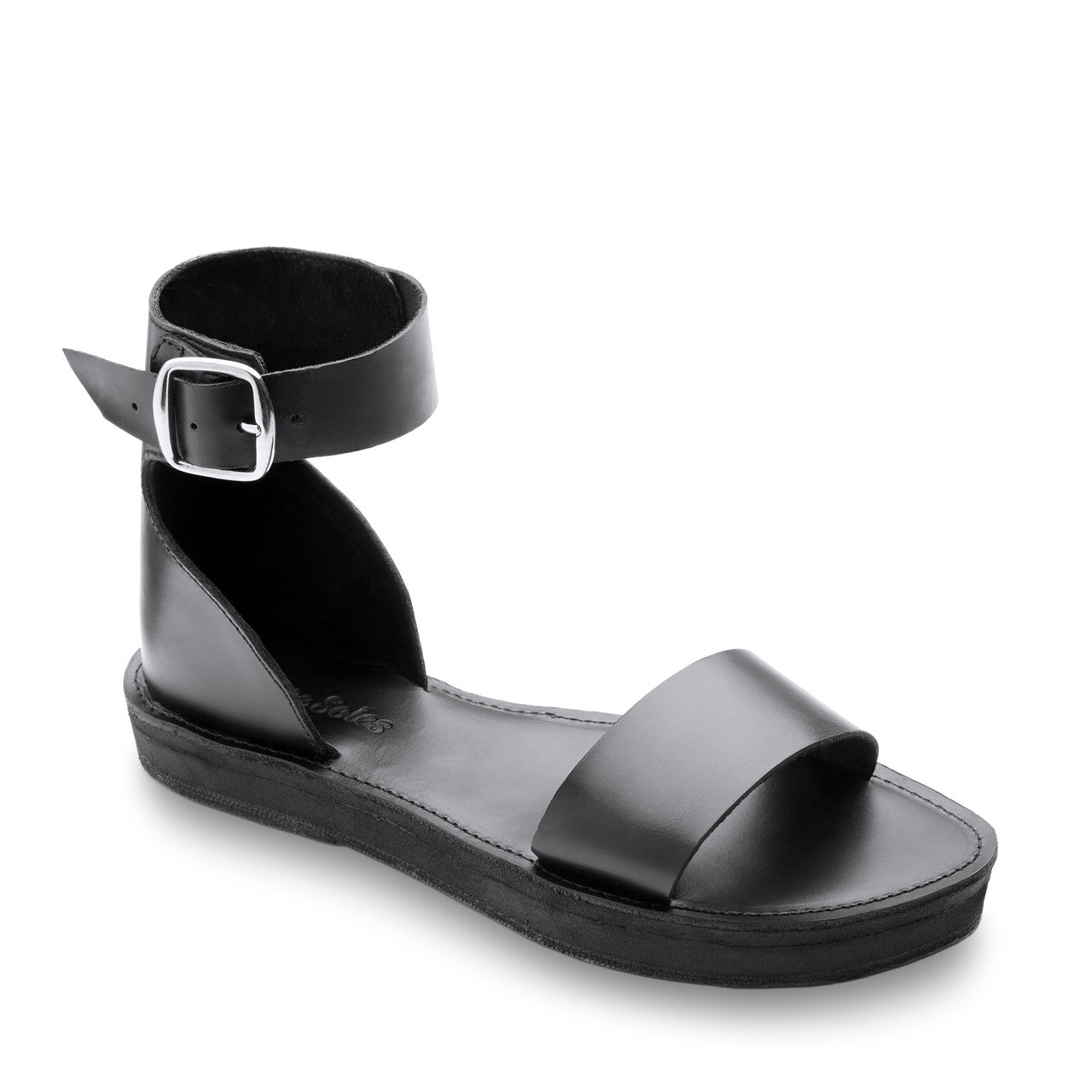 Black sandal with a buckle on a white background