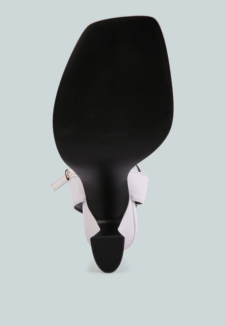 Black spatula with pink handle on a light gray background