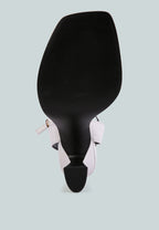 Black spatula with pink handle on a light gray background