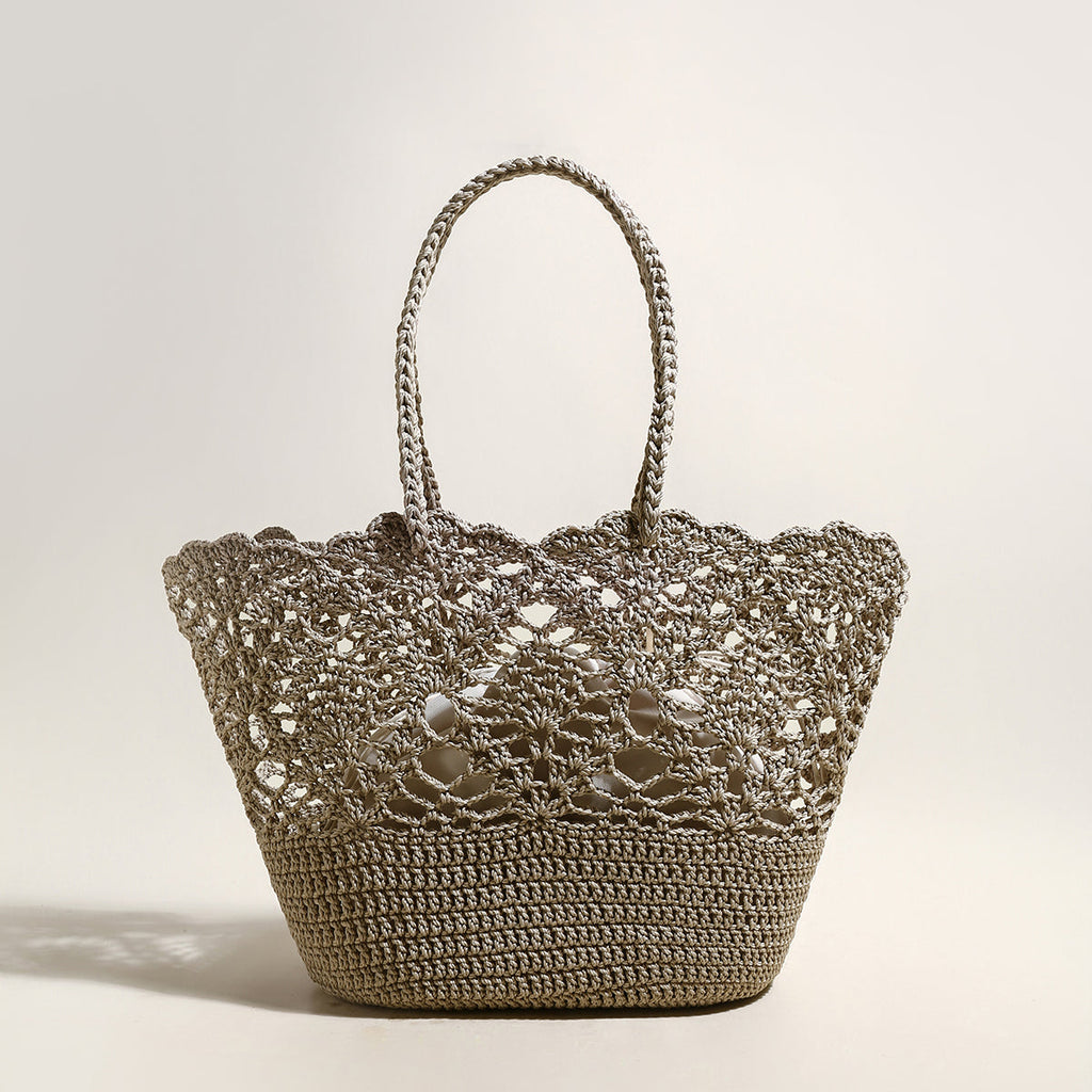 Crocheted handbag with lace detailing on a light background
