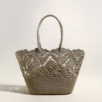 Crocheted handbag with lace detailing on a light background