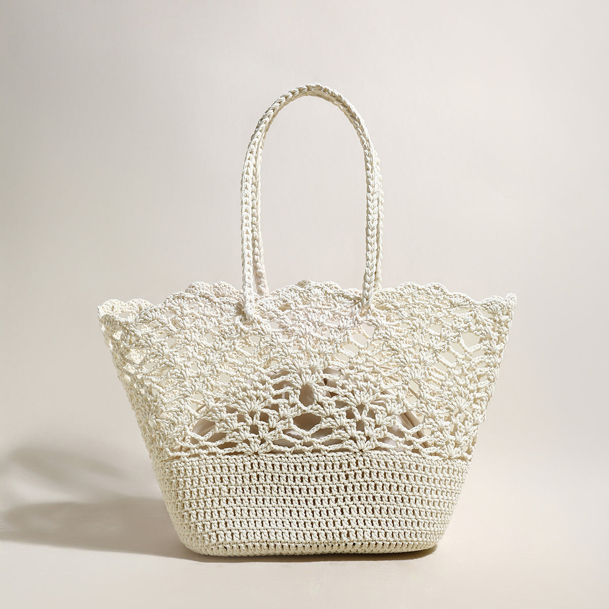 White woven handbag on a light background