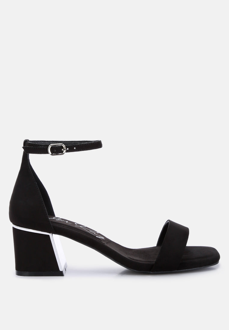 Black sandal with a block heel on a white background