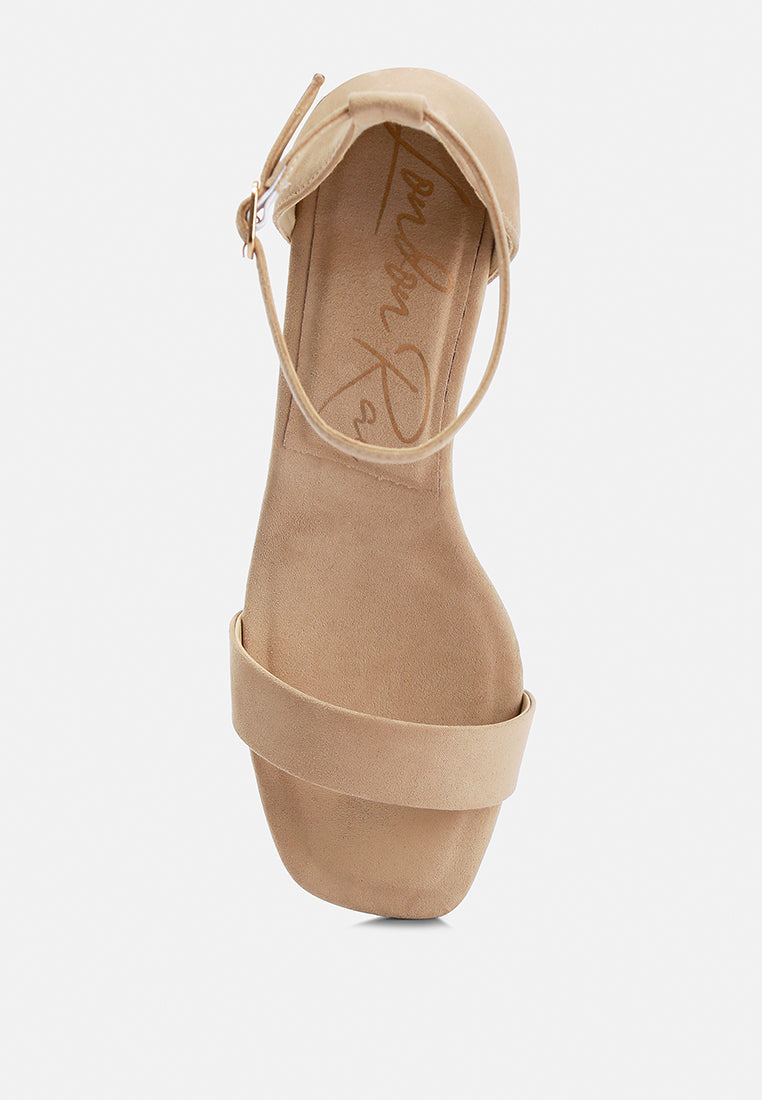 Beige sandal with platform sole on a white background