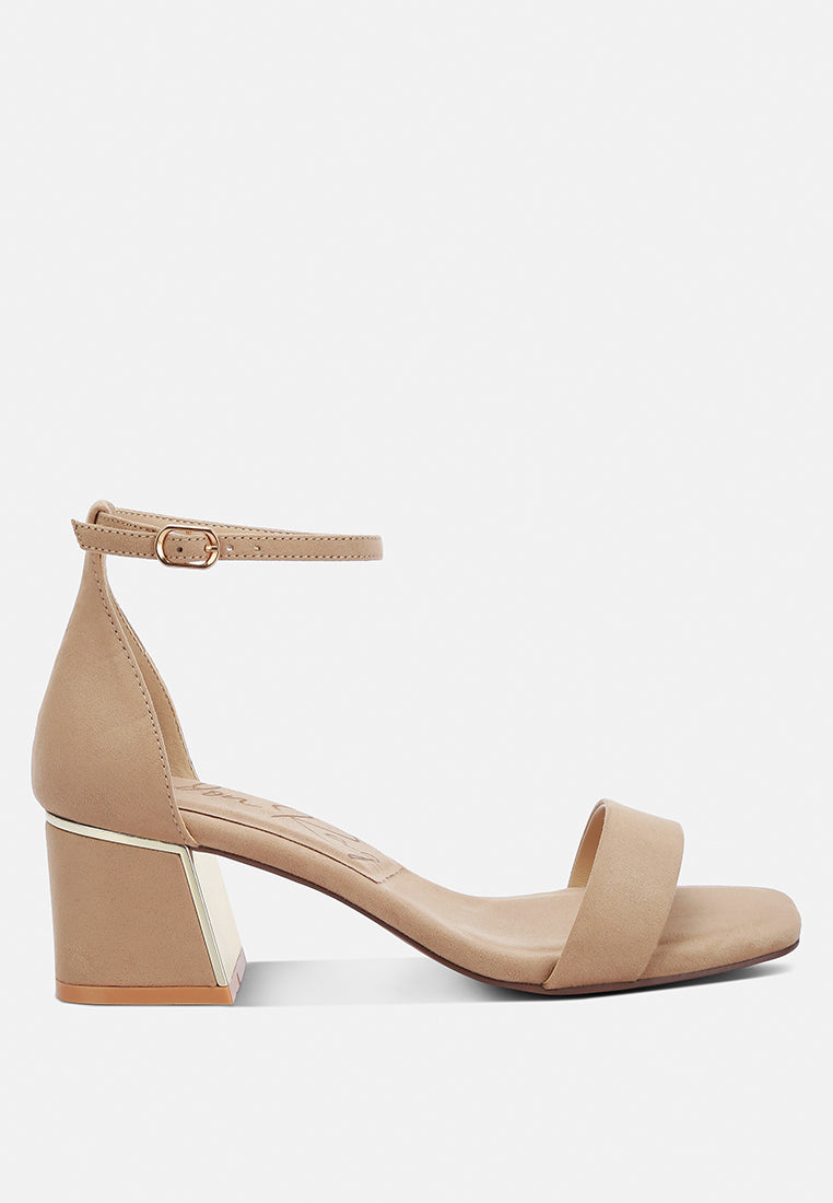 Beige sandal with block heel on a white background