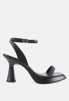 Black high-heeled sandal on a white background