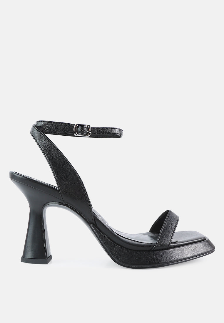 Black high-heeled sandal on a white background