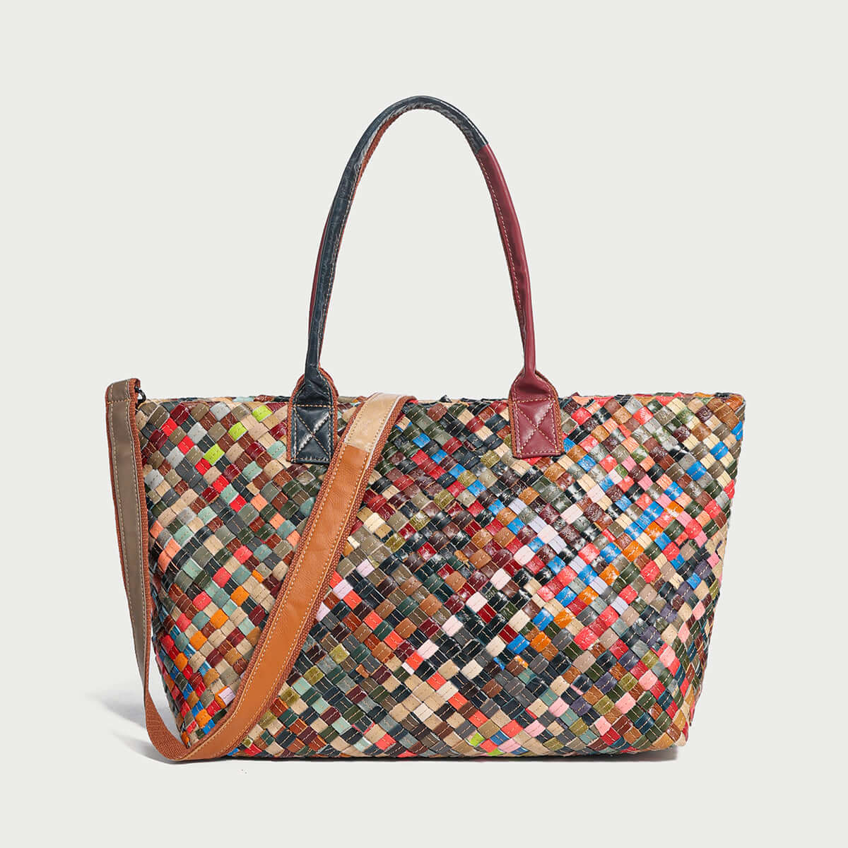 Flamboyant woven leather tote bag featuring a colorful pattern and dual handles, perfect for stylish everyday use.
