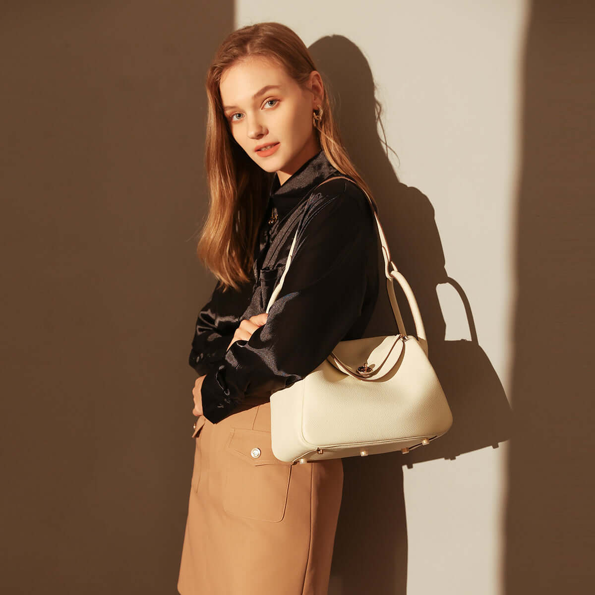 Model showcasing the stylish Monte Convertible Shoulder Bag against a neutral background.