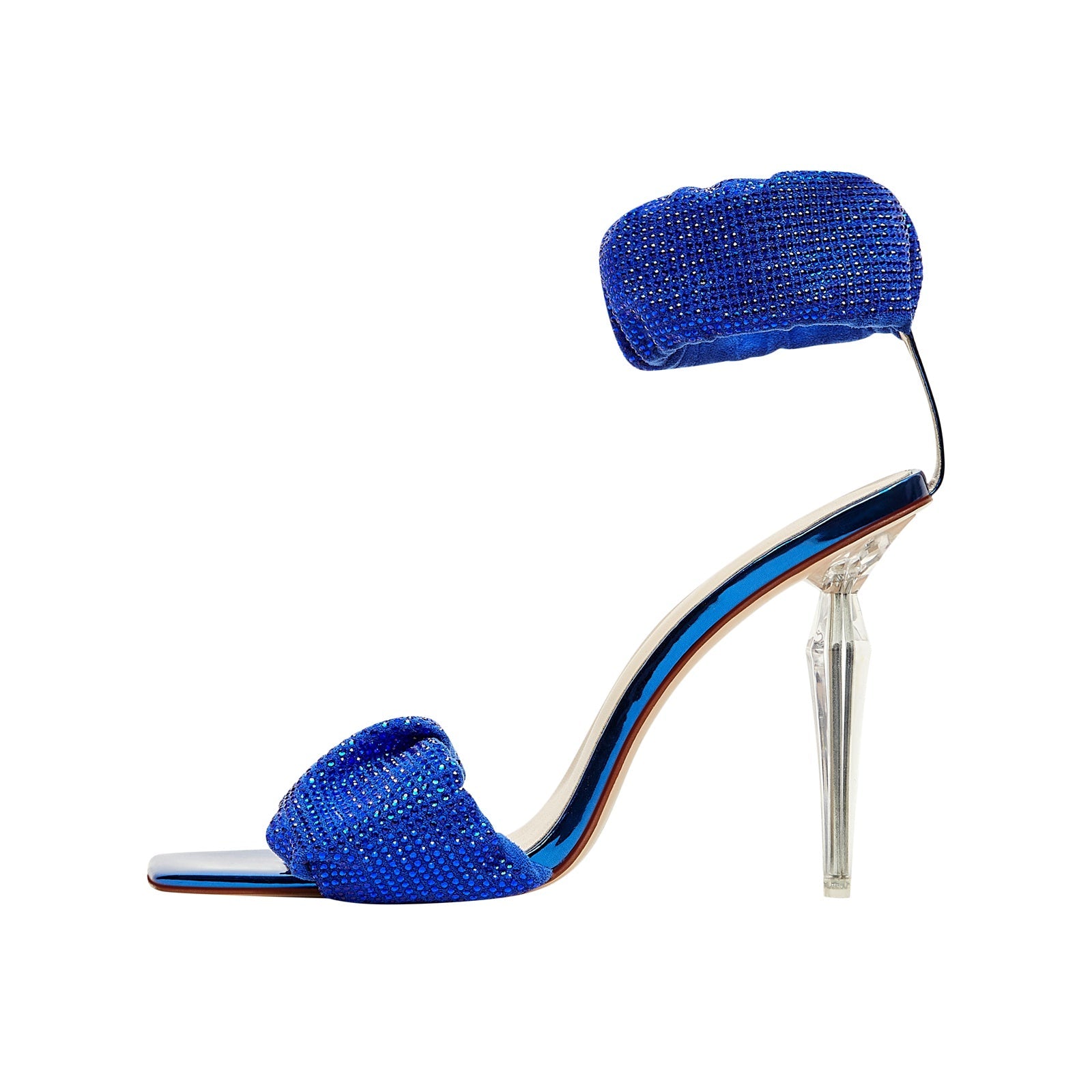 Blue high-heeled shoe with clear heel on a white background