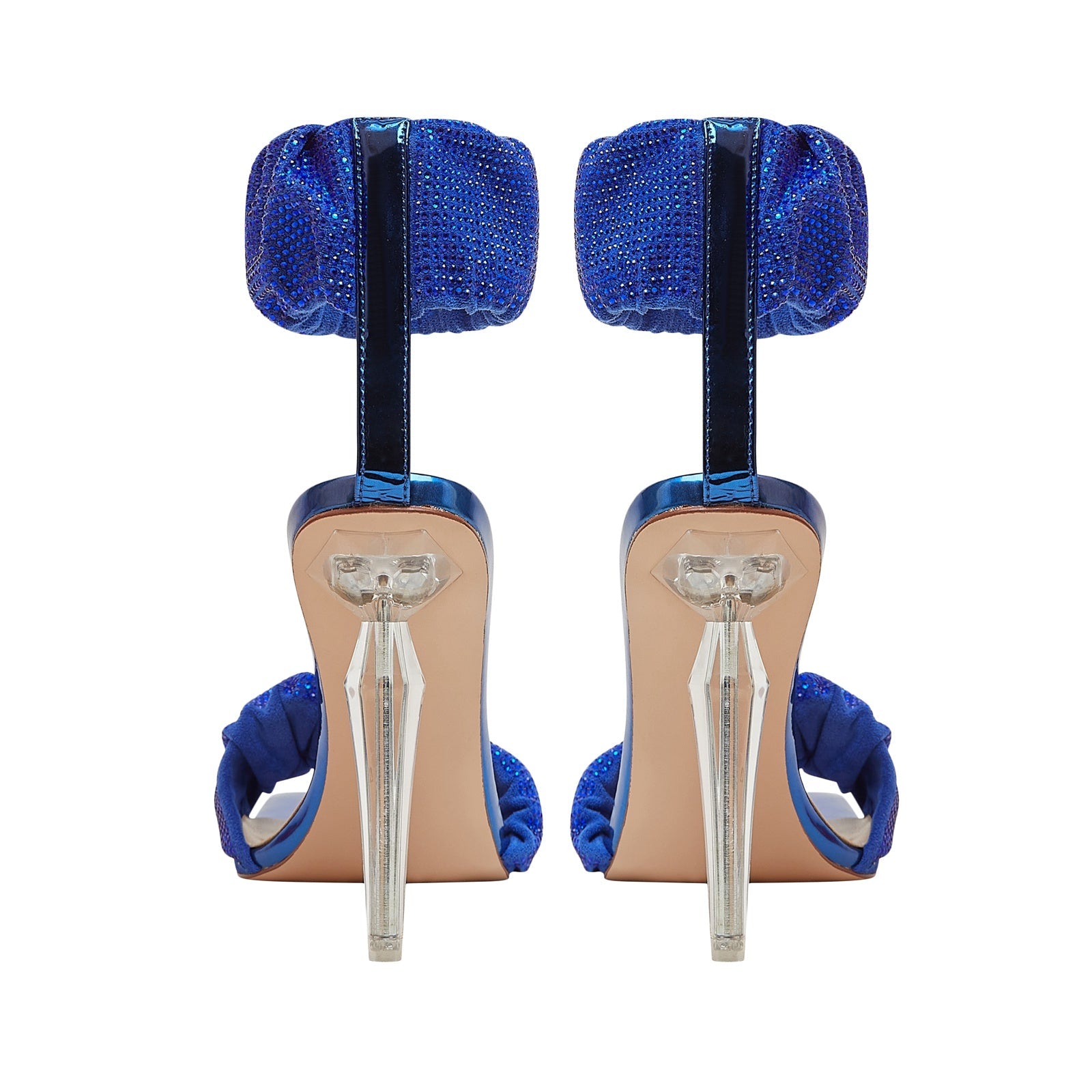 Pair of blue high-heeled shoes with clear straps on a white background